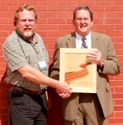 Dennis Willis, RMS President (left) presents 2013 River Manager of the Year Award to Greg Trainor