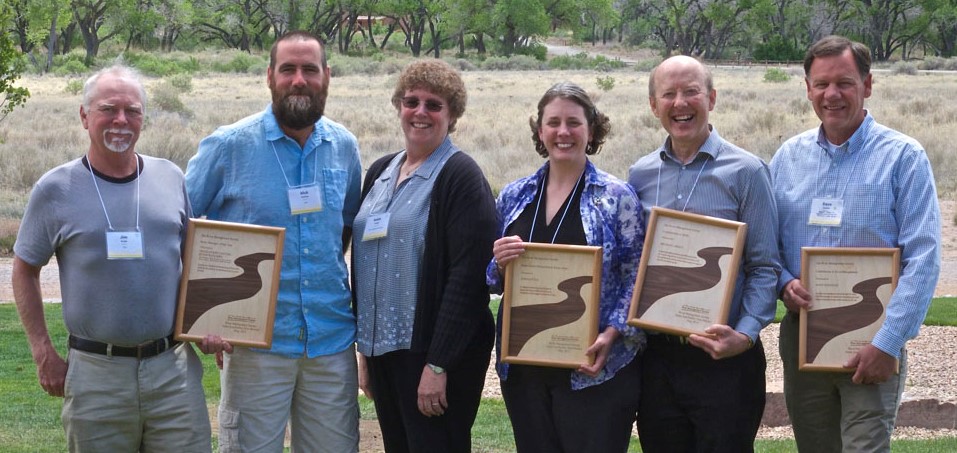 Photo (by Tim Palmer) at awards ceremoney,l to r: Jim Wright, Mick Krussow, RMS President Helen Clough, Shana Steward Deeds representing John Little, Don Gibson representing Michael Greco, and Dave Koehler