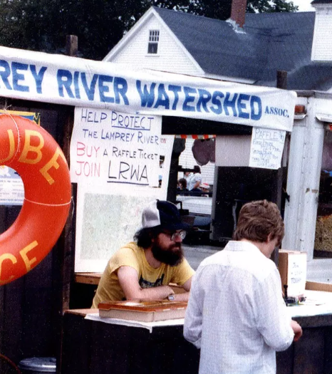 Dick Lord at LRWA booth promoting tube races.  Photo provided by RH Lord.