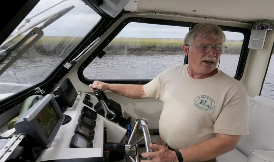 Fred Akers in one of his favorite places: on the river steering a boat. Fred is Great Egg Harbor’s Wild and Scenic River Administrator and has been a major force in getting key conservation allotments for the Great Egg. Photo by Dale Gerhard, Staff Photographer The Press of Atlantic City.