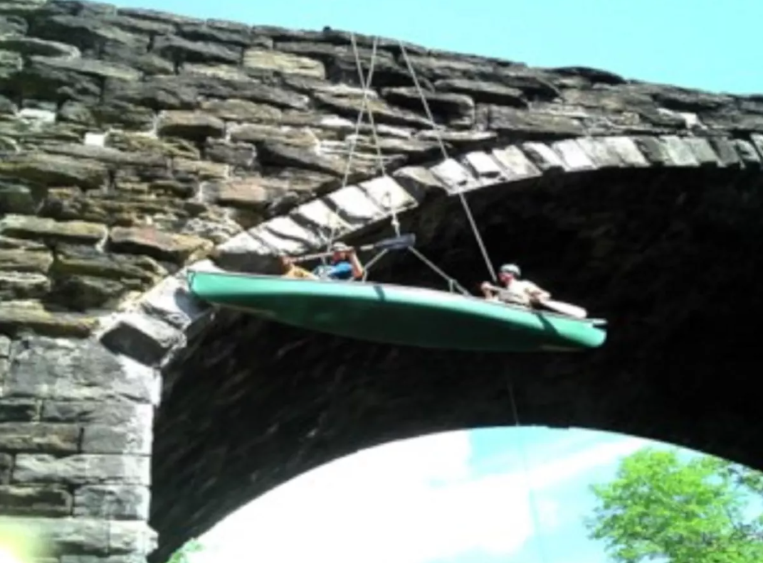 Volunteers used canoes to work on maintenance and repair the Keystone Arches. Photo credit: Keystone Arches website.
