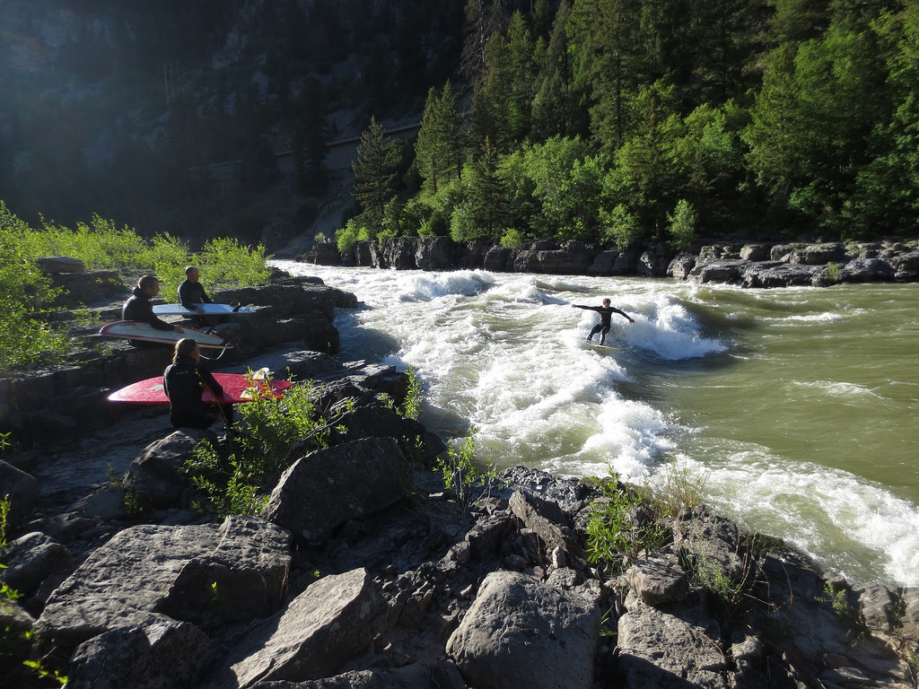 Surfing the Wild and Scenic Snake River of Wyoming. Photo: Max Mogren urfing the Wild and Scenic Snake River of Wyoming - An evening season with friends at the Lunch Counter Rapid.